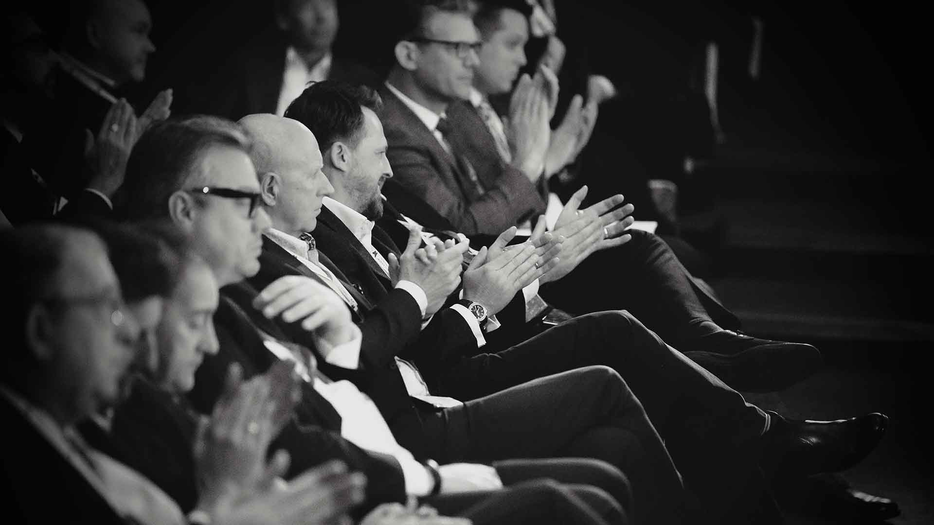 Financial advisers applauding at the Dynamic Planner conference